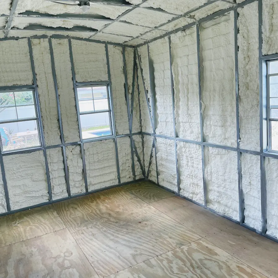 Closed-cell spray foam insulation applied to wall cavities in a residential project in Baldwin